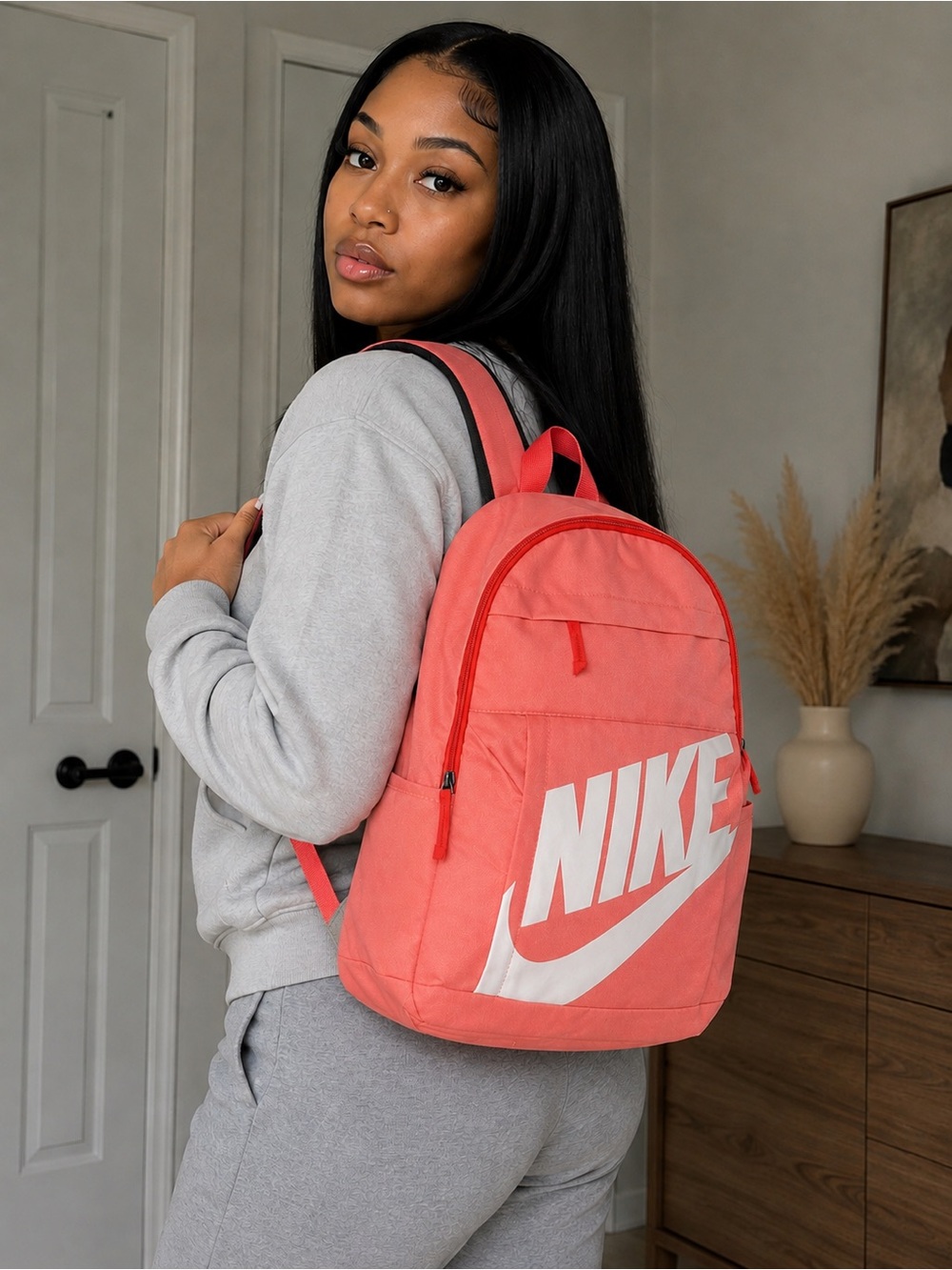 Nike Coral Pink Backpack with White Logo and Swoosh